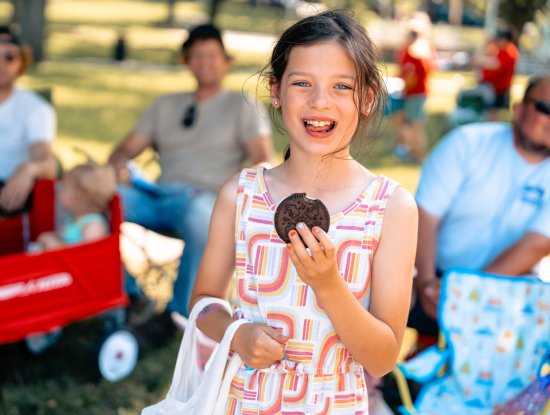 Girl eating a Blue Bunny Ice Cream Sandwich