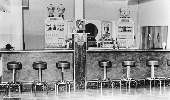 Ice cream sundae bar with stools